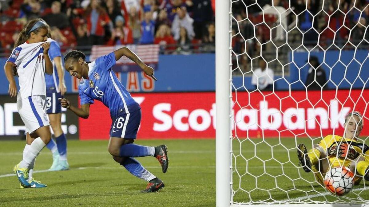 Crystal Dunn celebrates one of her second-half goals on Monday night.