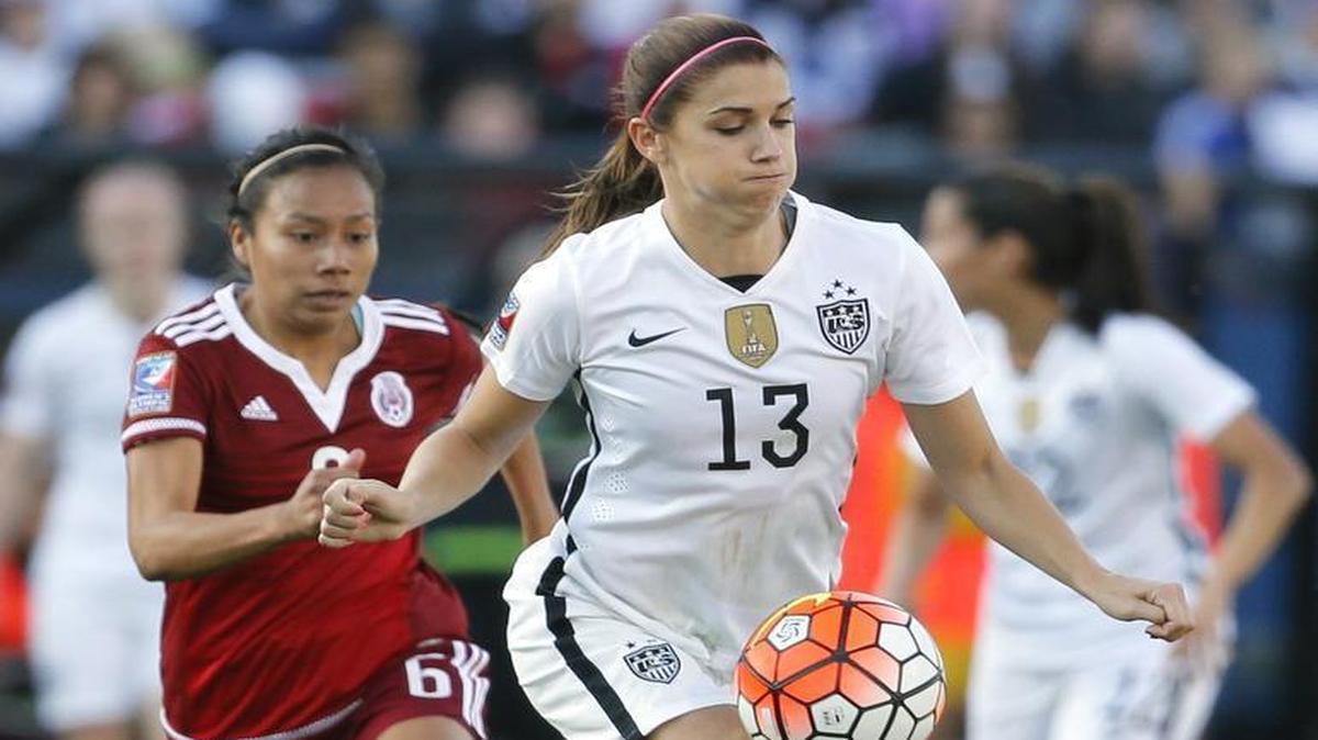 United States forward Alex Morgan (13) controls a pass in front of Mexico midfielder Karla Nieto (6) in the second half in Frisco.