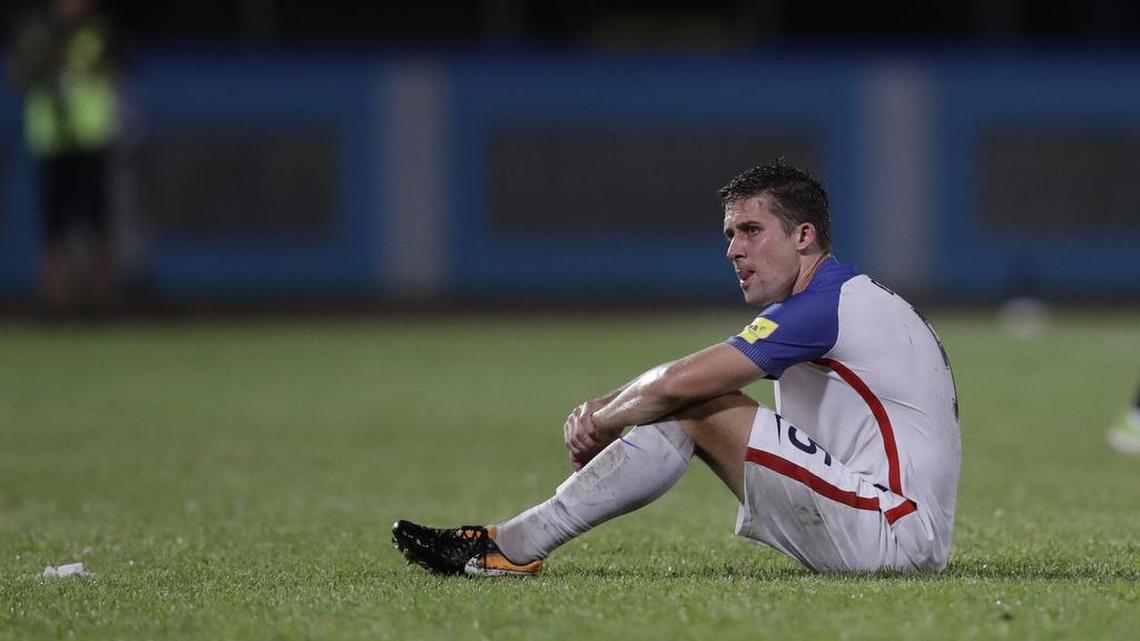 United States’ Matt Besler, squats on the pitch after losing 2-1 against Trinidad and Tobago during a 2018 World Cup qualifying soccer match in Couva, Trinidad on Tuesday, Oct. 10. The U.S. loss and was eliminated from the World Cup for the first time since 1986.
