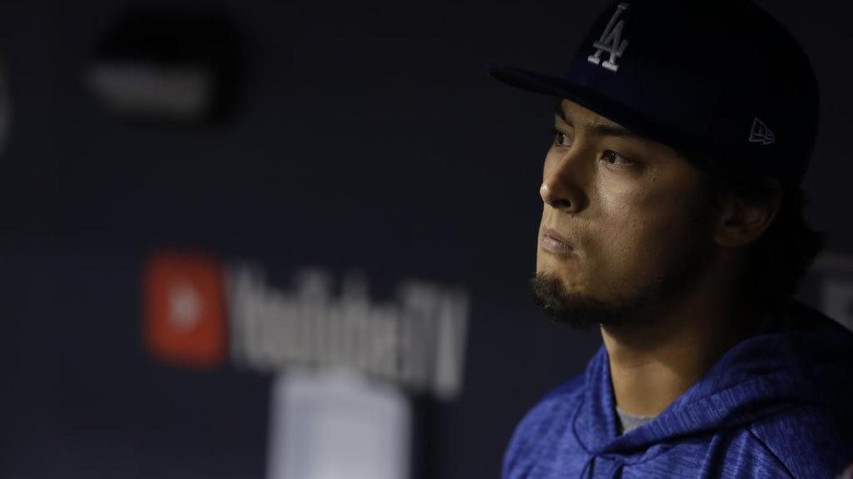 Los Angeles Dodgers' Yu Darvish watches from the dugout during Game 7 of the World Series. Darvish took two of the Dodgers’ four losses, including an epic batting practice session he threw in Game 7.