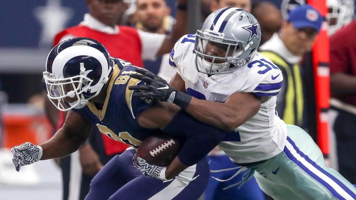 Cowboys safety Byron Jones, right, tries to wrap up Rams right end Gerald Everett on Sunday, but did not make any game-changing plays in linebacker Sean Lee’s injury absence.