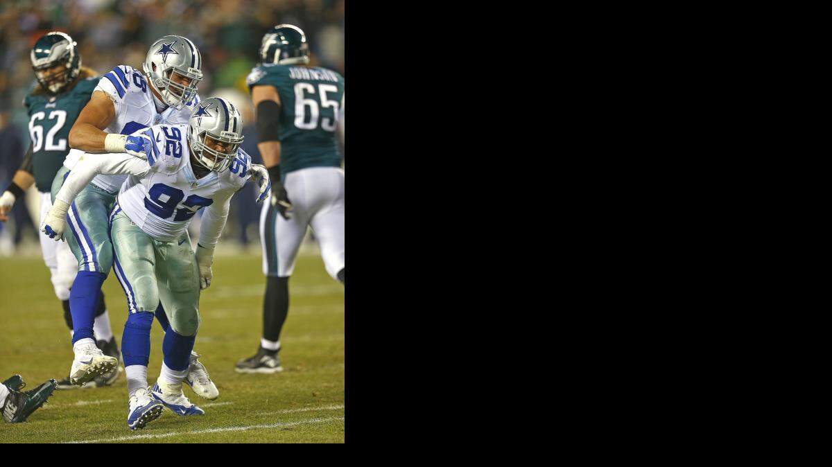 
Nick Hayden, left, and Jeremy Mincey celebrate after sacking Eagles quarterback Mark Sanchez. 

