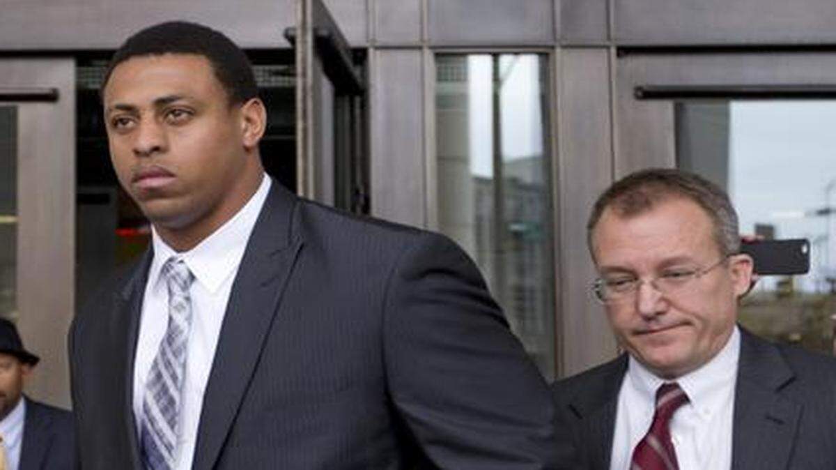 
Carolina Panthers defensive end Greg Hardy, center, leaves the Mecklenburg County Courthouse after his domestic violence charges were dismissed in Charlotte, N.C., Monday. 
