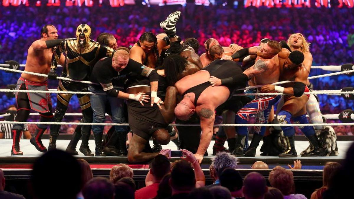 Shaquille O’Neal and Big Show are tossed from the ring during WrestleMania 32 on Sunday at AT&T Stadium.