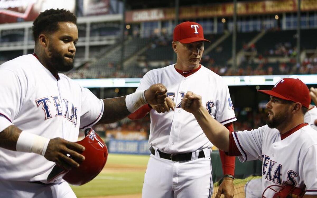 
Rookie manager Jeff Banister, center, has the Rangers playing as one this season.


