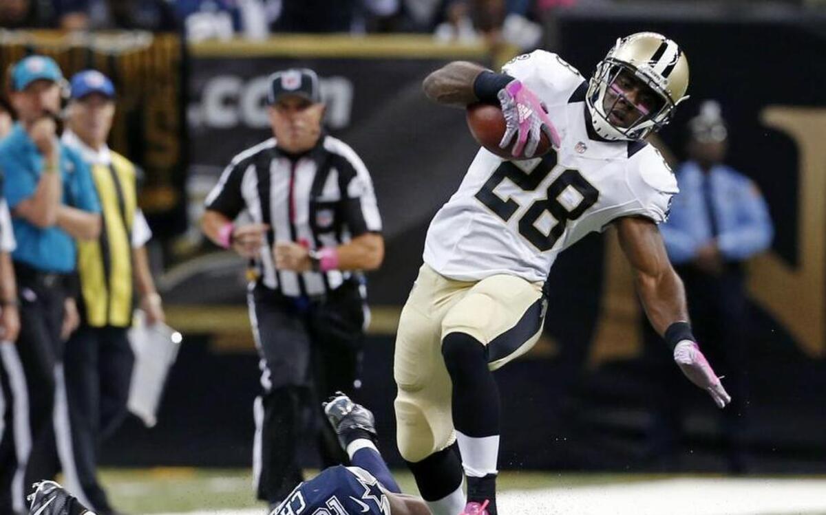 
Saints running back C.J. Spiller  eludes Barry Church’s tackle attempt on his way to an 80-yard game-winning touchdown.

