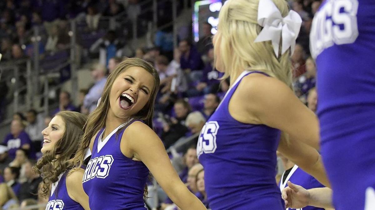 TCU Horned Frogs cheerleaders celebrate after the men's basketball team defeated SMU during the 2017-'18 season; TCU cheerleading coach, Mickey Farris, has been placed on administrative leave and is currently being investigated by the school.