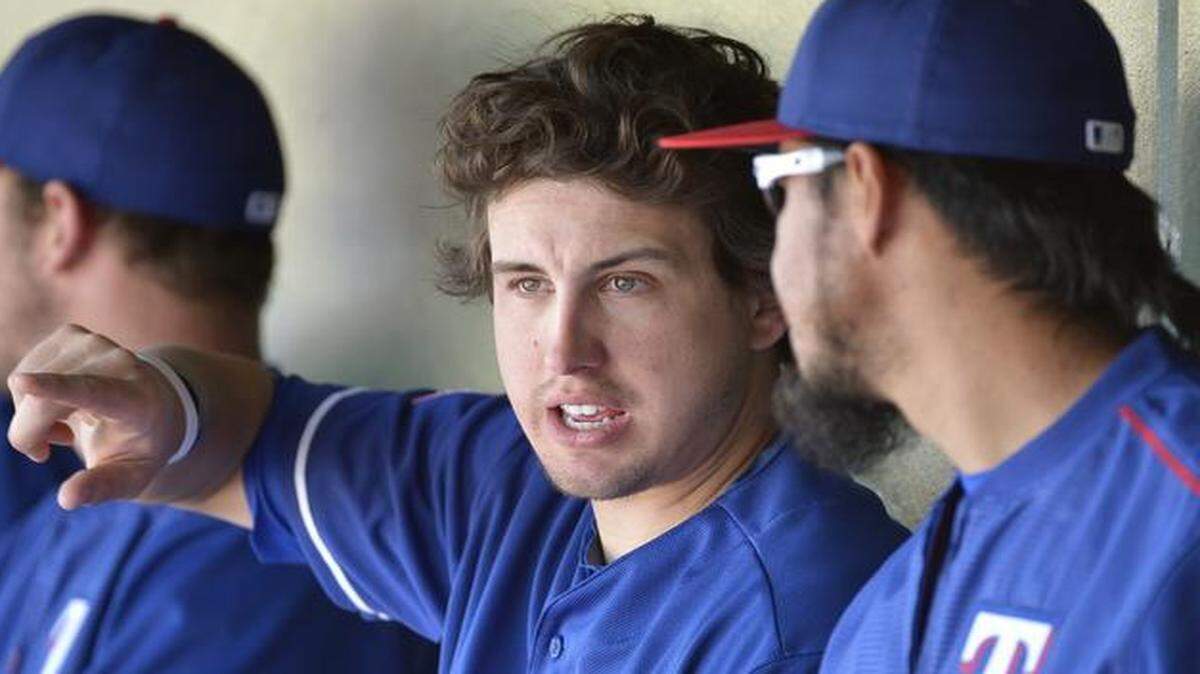 
The Rangers desperately need Derek Holland, center, to truly be the ace he believes he can be.


