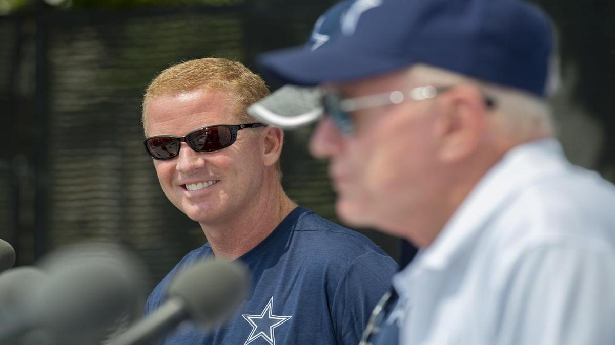 Dallas Cowboys head coach Jason Garrett looks over at team owner Jerry Jones, right, as he addresses the media during the "state of the team" press conference at the start of Dallas Cowboys' NFL football training camp, Friday, in Oxnard, Calif. Garrett is 45-43 in his career as coach of the Cowboys.