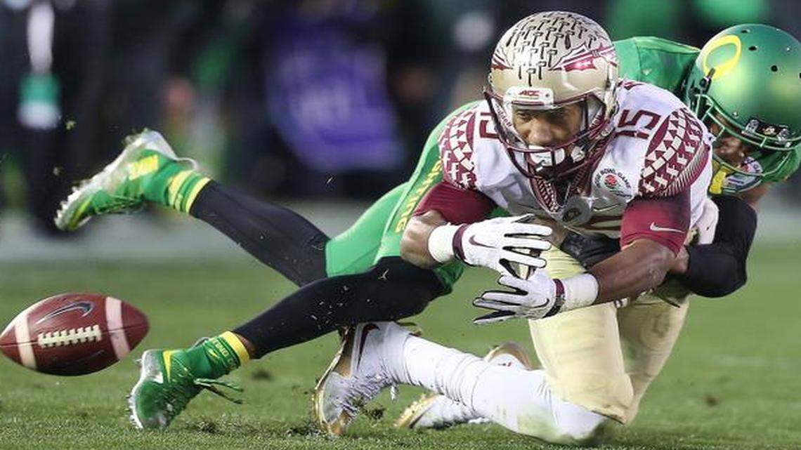 
Oregon cornerback Troy Hill knocks the ball away from Florida State wide receiver Travis Rudolph in the Rose Bowl on Thursday,. Oregon won 59-20. 
