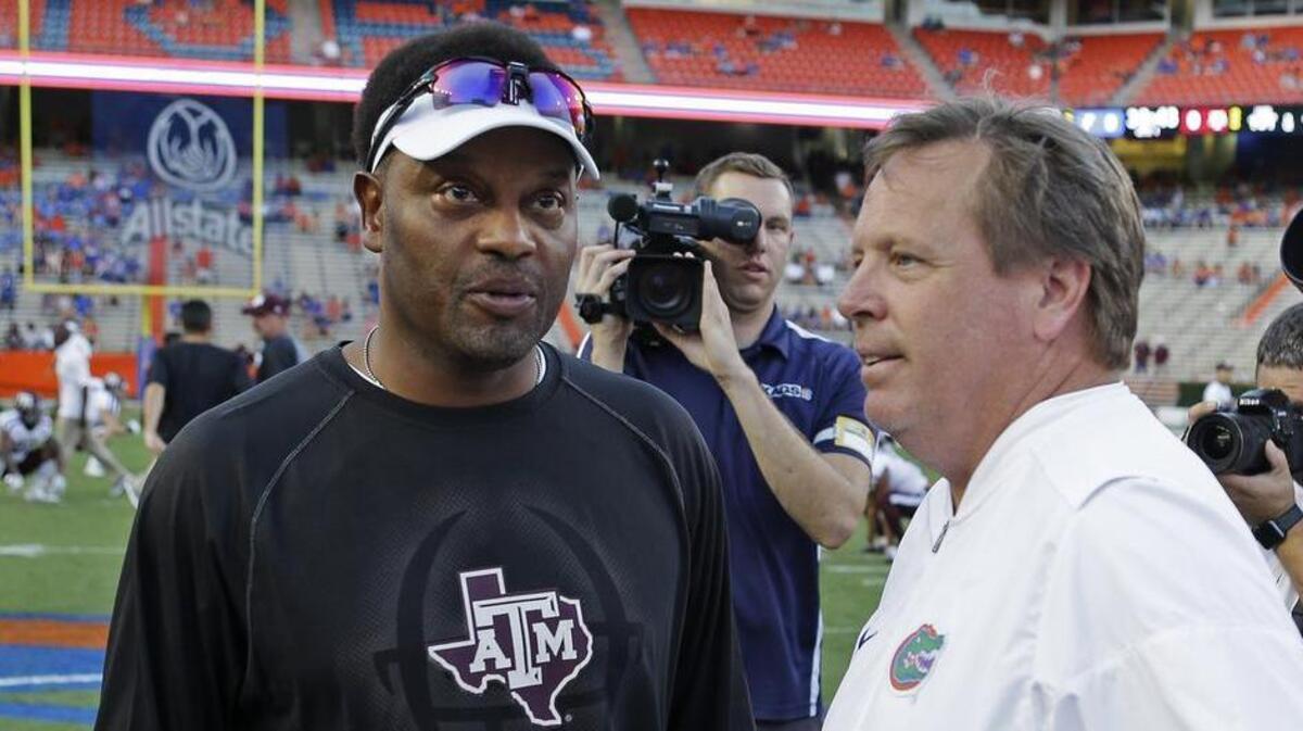 Texas A&M head coach Kevin Sumlin, left, and Florida head coach Jim McElwain meet at midfield before their game in 2017. McElwain is already out at Florida, and Sumlin is expected to be gone after this season.