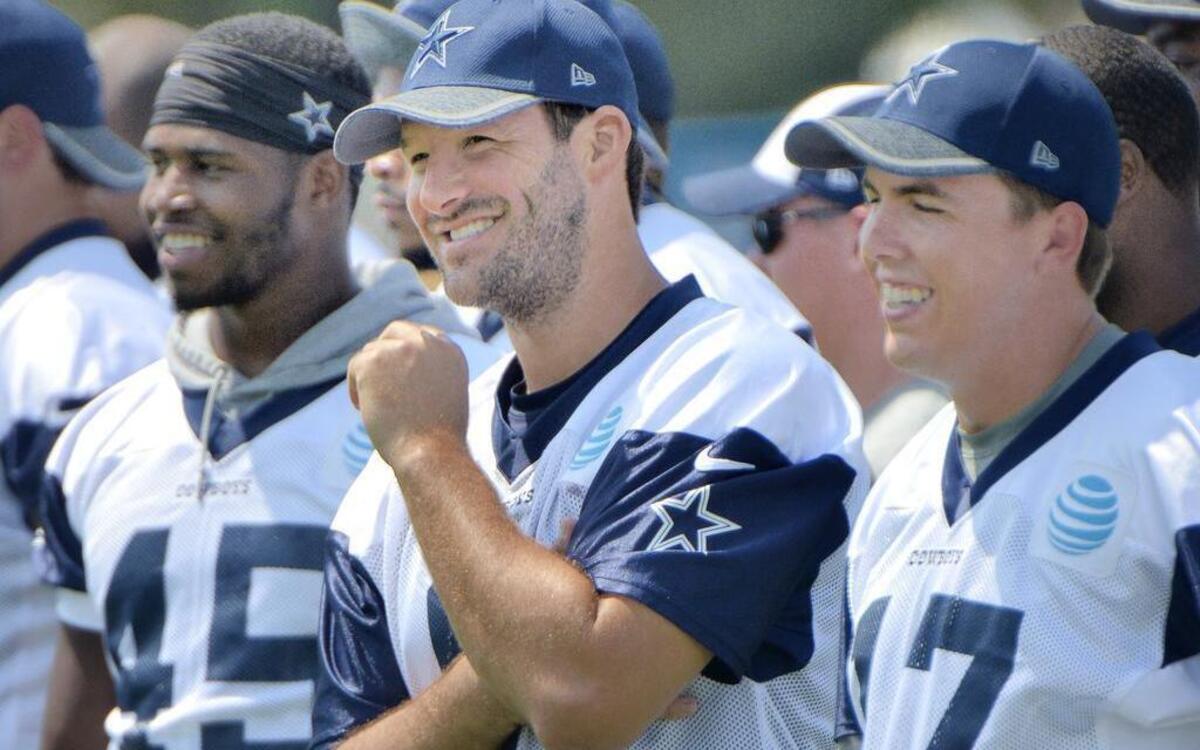 Cowboys quarterback Tony Romo, center, did not practice Sunday at training camp in Oxnard, Calif. Despite Romo’s ability to make plays, the Cowboys should not trust the franchise quarterback’s ability to avoid injuries given his past.