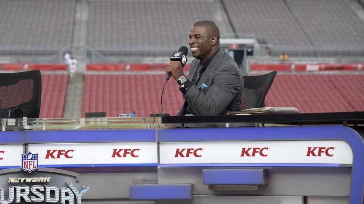 Former Dallas Cowboys defensive back and current NFL Network blowhard Deion Sanders torched CBS broadcaster Tony Romo after the former Cowboys quarterback had some fun at his expense during the telecast of the Cowboys/Chiefs game on Sunday.
