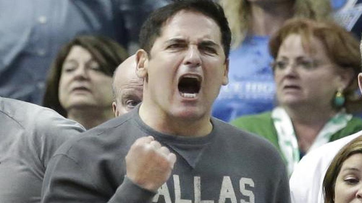
Dallas Mavericks owner Mark Cuban, center, yells after a call against his team during the second half an NBA basketball game against the Boston Celtics Monday, March 17, 2014, in Dallas. 
