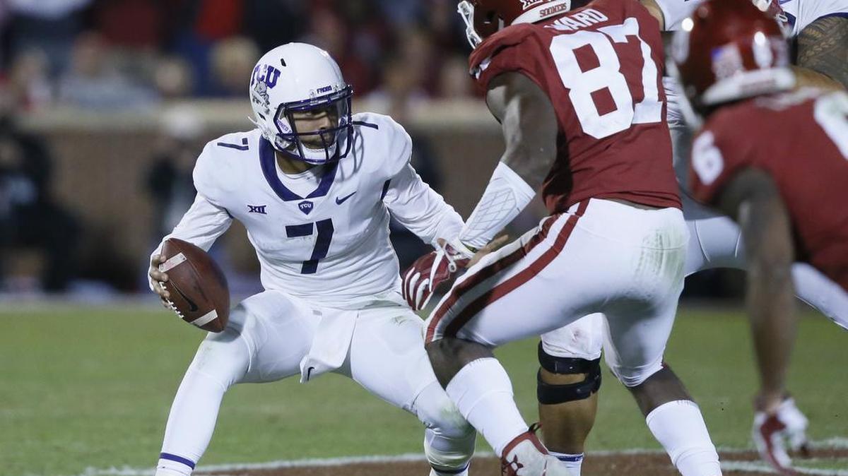 TCU quarterback Kenny Hill, here playing against Oklahoma on Saturday in Norman, will not make the trip with his team to play at Texas Tech because he is suffering from concussion-like symptoms.