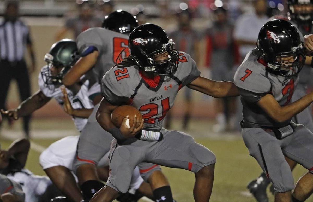 Diamond Hill-Jarvis running back Deon Ross cuts around defenders during the Eagles’ game against Kennedale.