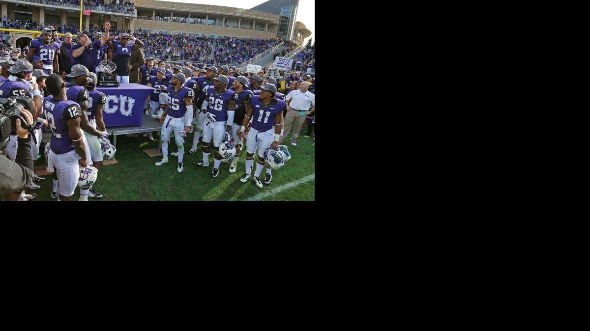 
TCU coach Gary Patterson with his players during the trophy presentation after the Horned Frogs beat Iowa State 55-3. 
