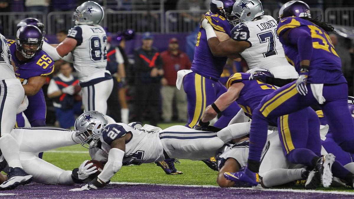Ezekiel Elliott dives into the Vikings’ end zone from a yard out for a touchdown in the second quarter. Elliott had 86 yards on 20 carries.