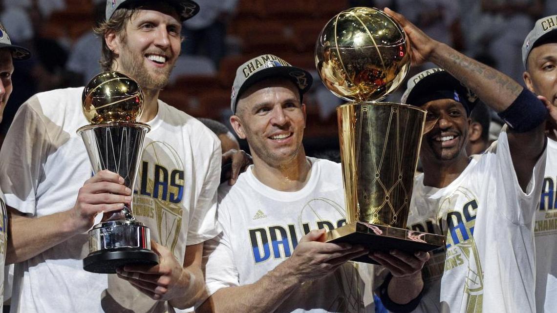 Dallas Mavs forward Dirk Nowitzki (left) celebrates the 2011 NBA title with Jason Kidd (center) and Jason Terry after their defeat of LeBron James and the Miami Heat in Miami.