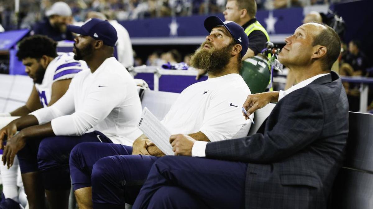 Dallas Cowboys center Travis Frederick, second from the right, looks on from the bench during the first half of a preseason NFL football game against the Arizona Cardinals on Sunday, August 26, 2018 at AT&T Stadium in Arlington, Texas. (Special to the Star-Telegram/Ray Carlin)
