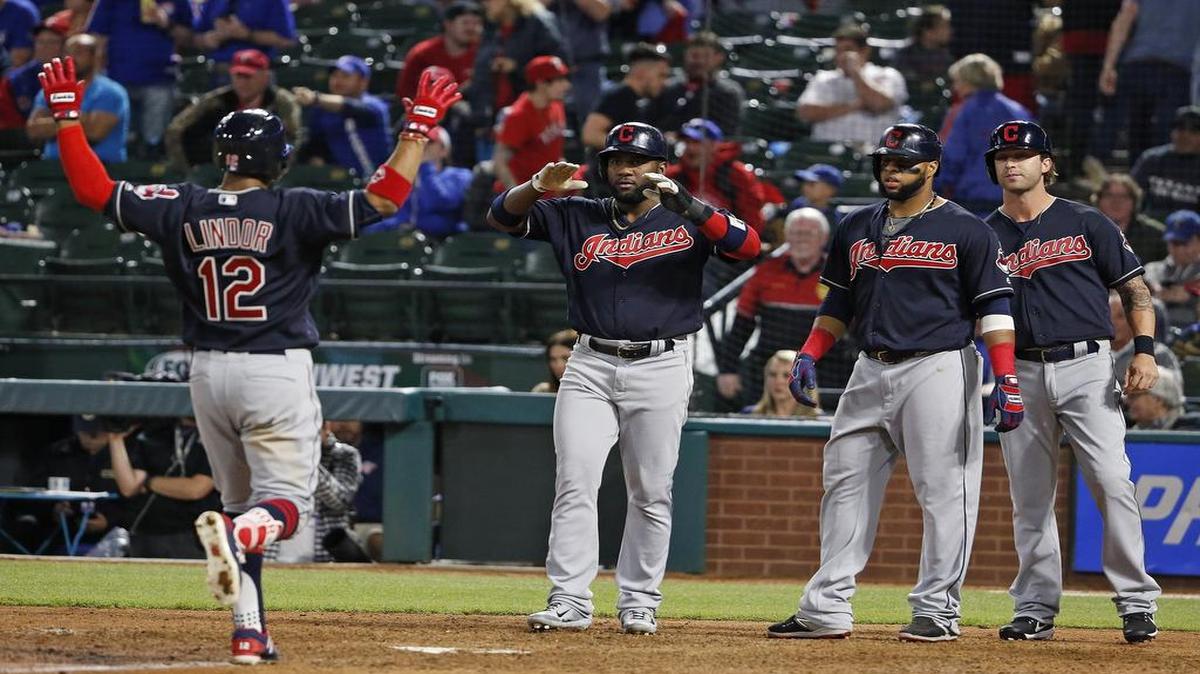 Indians shortstop Francisco Lindor arrives at home after a ninth inning grand slam as the Indians beat the Rangers 9-6 Wednesday night at Globe Life Park. Cleveland scored five runs in the ninth against closer Sam Dyson to rally for the win.