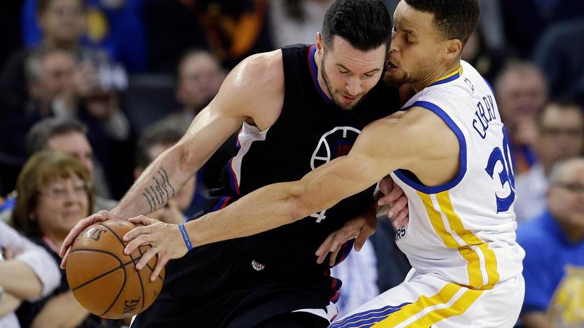 Golden State Warriors gaurd Stephen Curry strips the ball from Clippers guard J.J. Redick in Wednesday’s game. The Dallas Mavericks visit Golden State at 9:30 p.m. Friday. The Warriors are 64-7 and need to go 9-2 in the final 11 games of the regular season to break the Chicago Bulls’ record of 72 wins in a season. Golden State won 114-98 Wednesday.