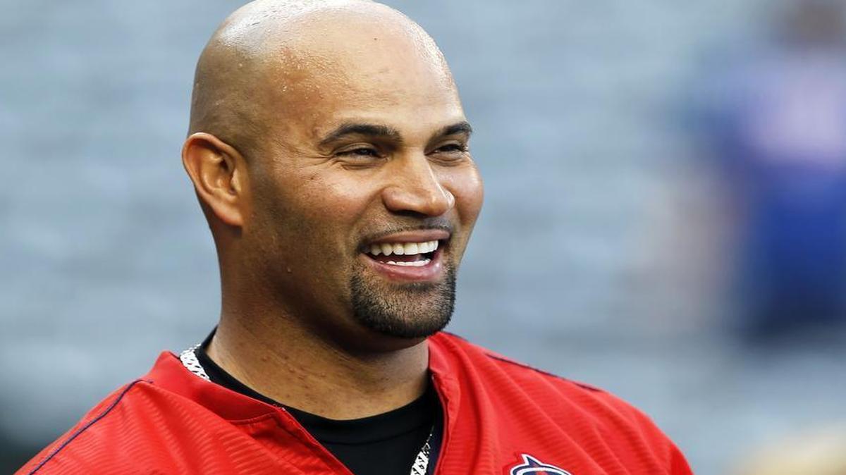 Los Angeles Angels slugger Albert Pujols laughs at the batting cage during warm-ups before a game this week. Pujols and the Angels face the Rangers at 8 p.m. Saturday and 2:30 p.m. Sunday in Anaheim.