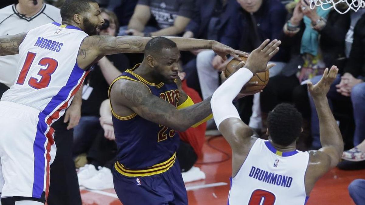 Detroit Pistons forward Marcus Morris, left, and center Andre Drummond (0) defend against Cleveland Cavaliers forward LeBron James in Game 3 of a first-round NBA basketball playoff series, Friday, April 22, 2016, in Auburn Hills, Mich. The Pistons (13-13) visit the Dallas Mavericks at 7:30 p.m. Wednesday at American Airlines Center in Dallas. The telecast is on FSSW.
