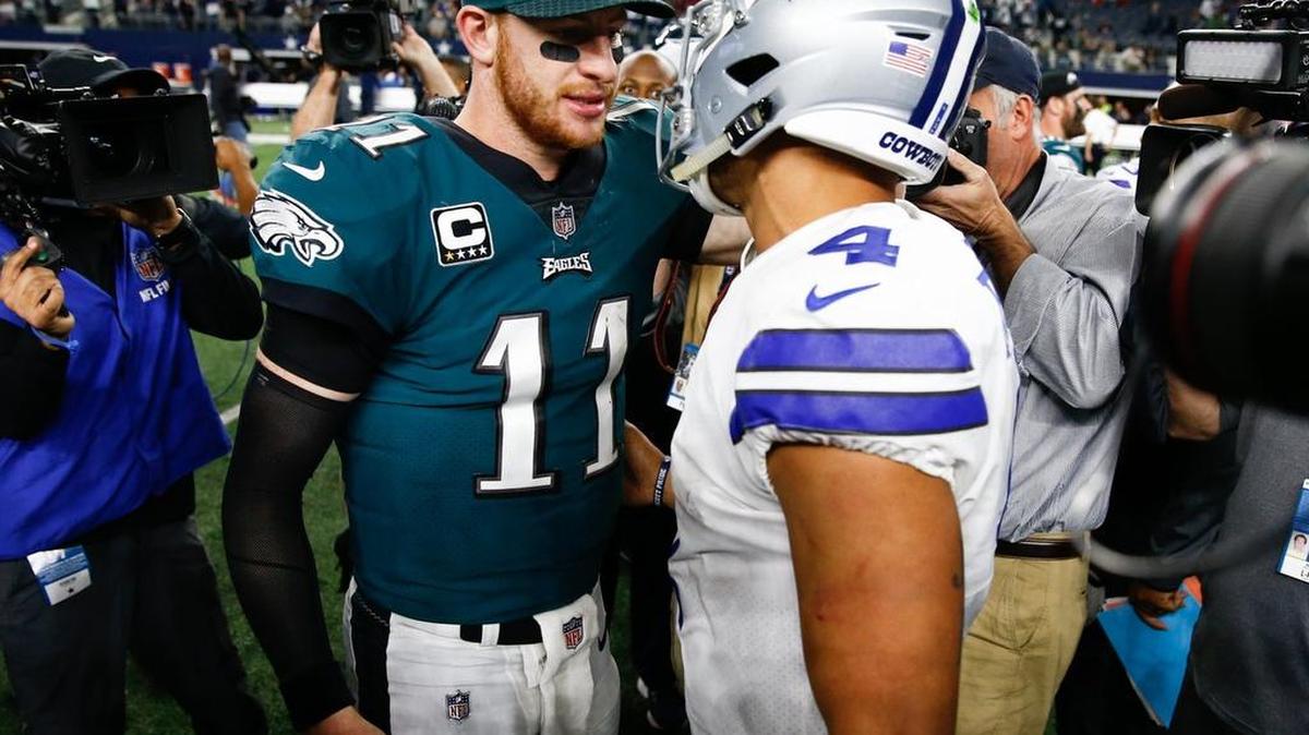 Philadelphia Eagles quarterback Carson Wentz (11) and Dallas Cowboys quarterback Dak Prescott (4) meet on the field after an NFL football game, Sunday, November 19, 2017, at AT&T Stadium in Arlington, Texas. The Eagles won 37-9. (Special to the Star-Telegram/Jim Cowsert)