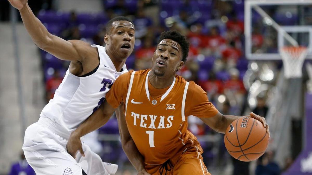 Texas guard Isaiah Taylor (1) drives inside against TCU guard Brandon Parrish during the first half of an NCAA college basketball game Saturday, Jan. 9, 2016, in Fort Worth, Texas.