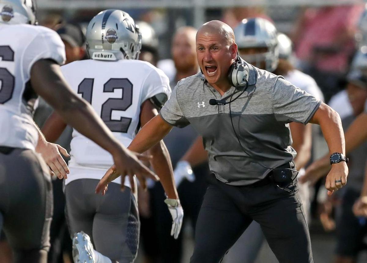 Arlington Martin head coach Bob Wager celebrates after his team scored a touchdown against Soutlake Carroll.