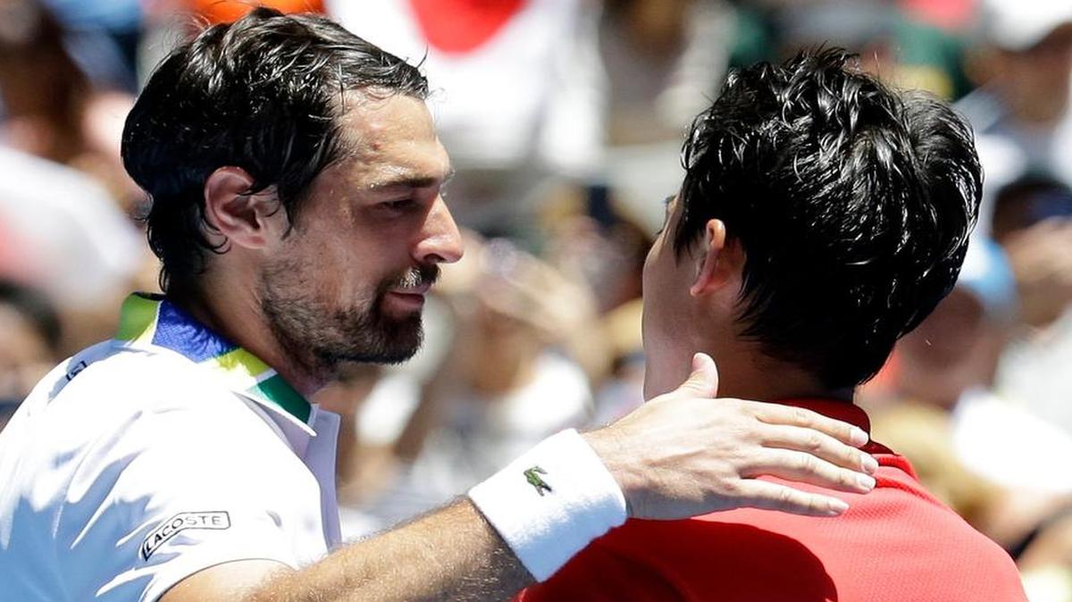 France’s Jeremy Chardy, left, congratulates Kei Nishikori after Nishikori won their second-round match at the Australian Open in January. On Thursday, Chardy scored an upset win at the Irving Challenger tournament at Las Colinas.