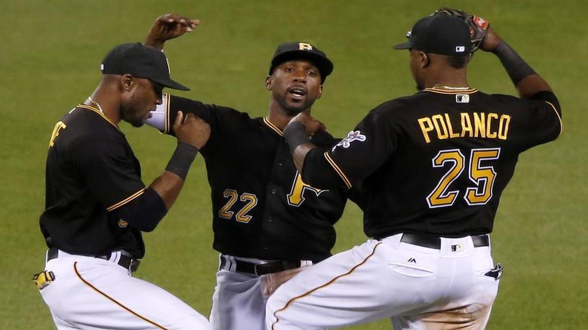 Pittsburgh Pirates outfielders Starling Marte, from left, Andrew McCutchen and Gregory Polanco (25) celebrate after getting the final out Wednesday against the Diamondbacks in Pittsburgh. The Pirates face the Texas Rangers at 6:15 p.m. Saturday on KDFW/Channel 4 in a regional Fox game.