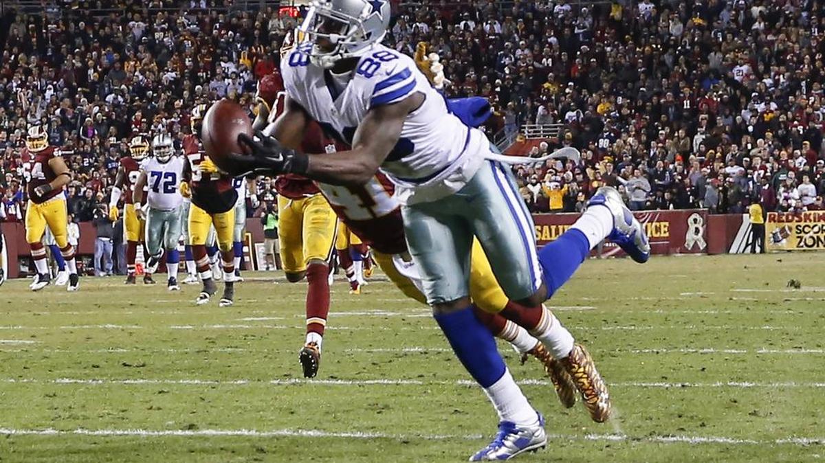 Dallas Cowboys wide receiver Dez Bryant (88) pulls in a pass under pressure from Washington Redskins cornerback Will Blackmon (41) during the second half of an NFL football game in Landover, Md., Monday, Dec. 7, 2015.