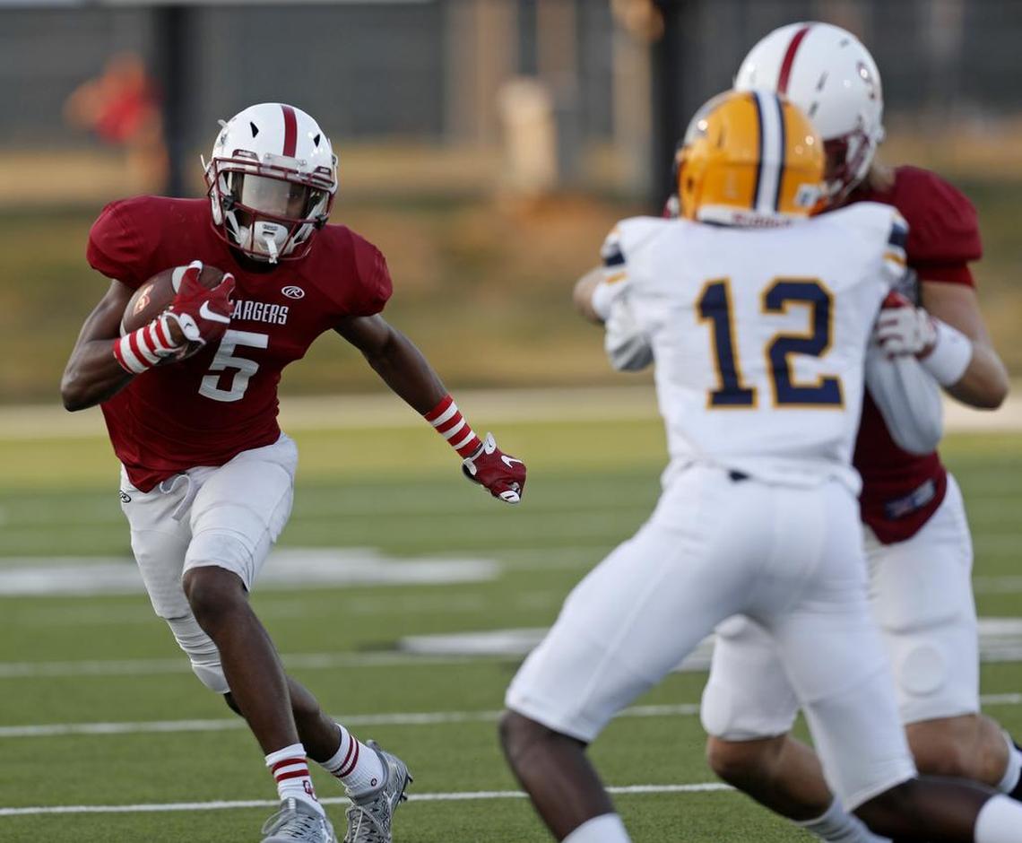 Keller Central wide receiver D.J. Graham gains short yardage as Lamar played Keller Central in high school football at KISD Athletic Complex Thursday September 14, 2017.