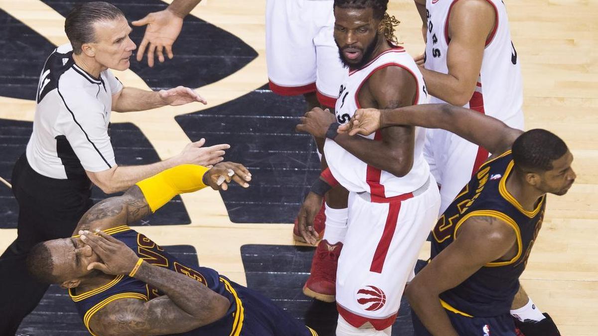 Cleveland Cavaliers forward Tristan Thompson, right, inadvertently hits teammate LeBron James as Toronto Raptors forward DeMarre Carroll looks on during the first half of Game 3 on Saturday. James’ reaction led some to believe he had been hit by Carroll. Game 4 of the NBA Eastern Conference Finals is at 7:30 p.m. Monday on ESPN.