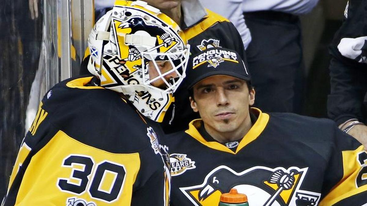 Pittsburgh Penguins goalie Matt Murray (30) takes a timeout with fellow goalie Marc-Andre Fleury (29) on Feb. 19 against the Detroit Red Wings. Fleury is in the middle of NHL trade speculation, with the Dallas Stars being one of the teams reported this month to be in the mix. The Penguins and Stars face off at 7:30 p.m. Monday at American Airlines Center in Dallas.